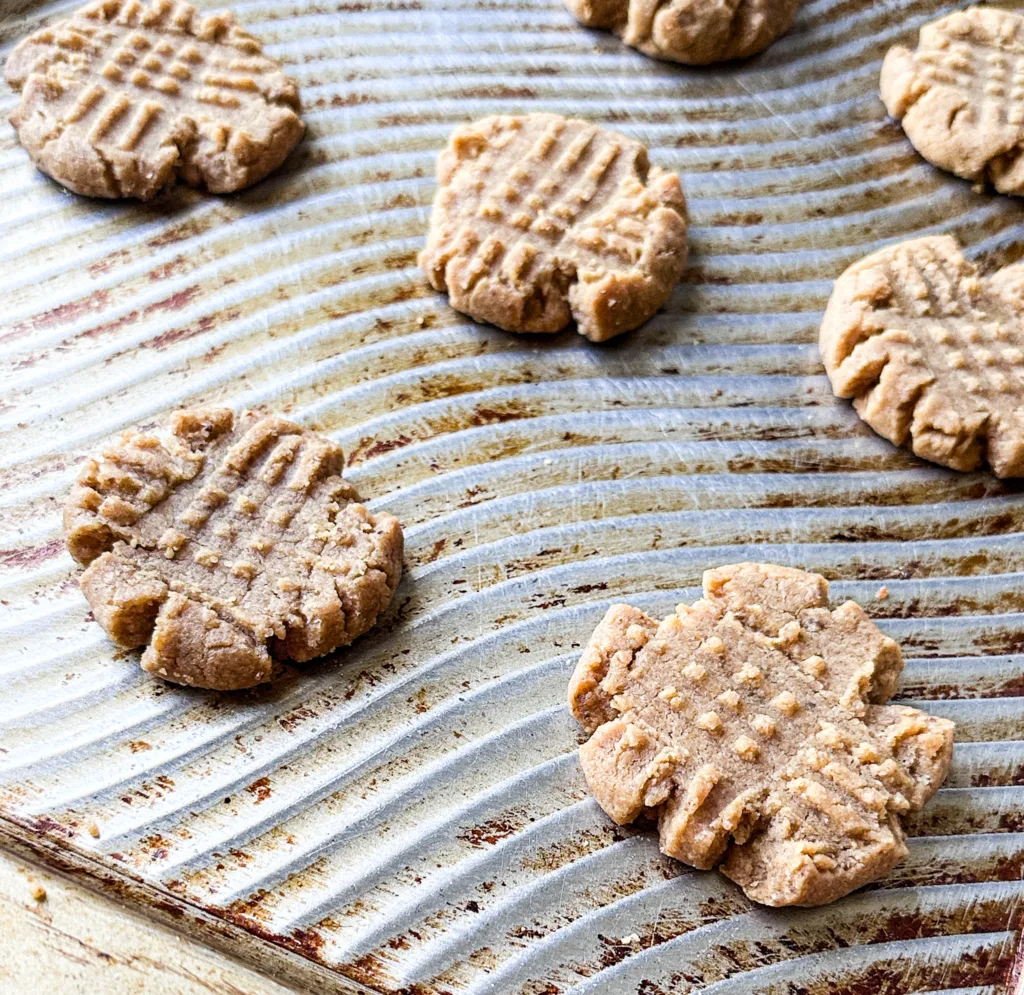 Egg-free peanut butter cookies on a cookie sheet.