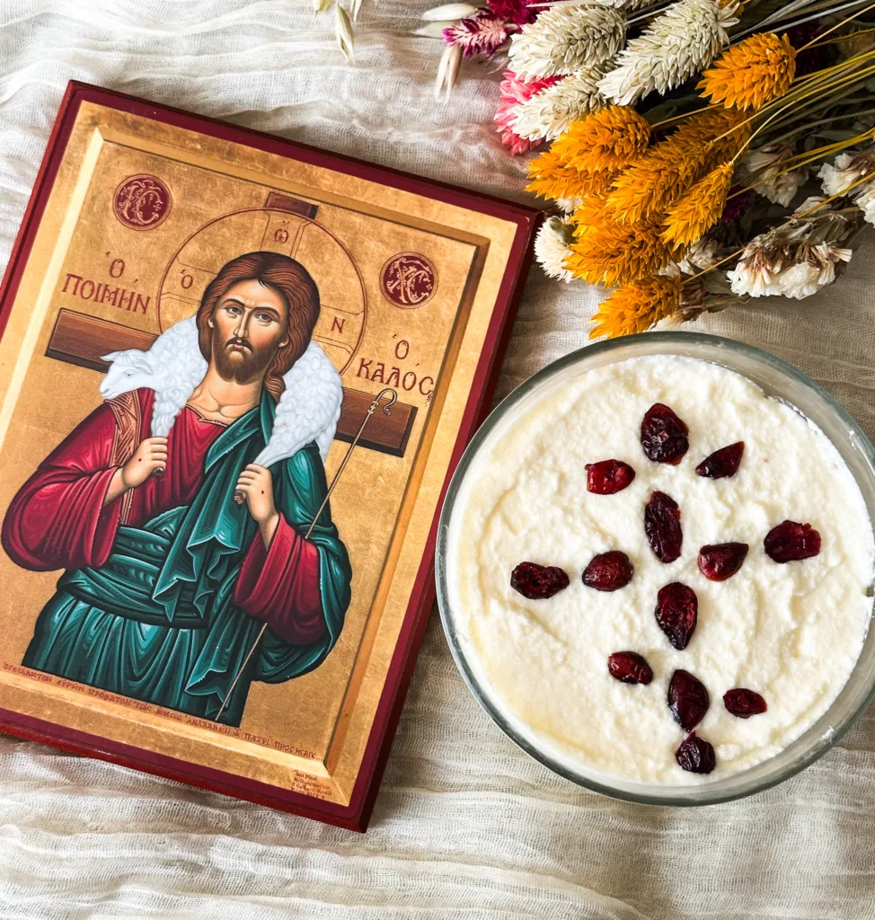 Cheese pascha next to some dried flowers and an icon of Christ.