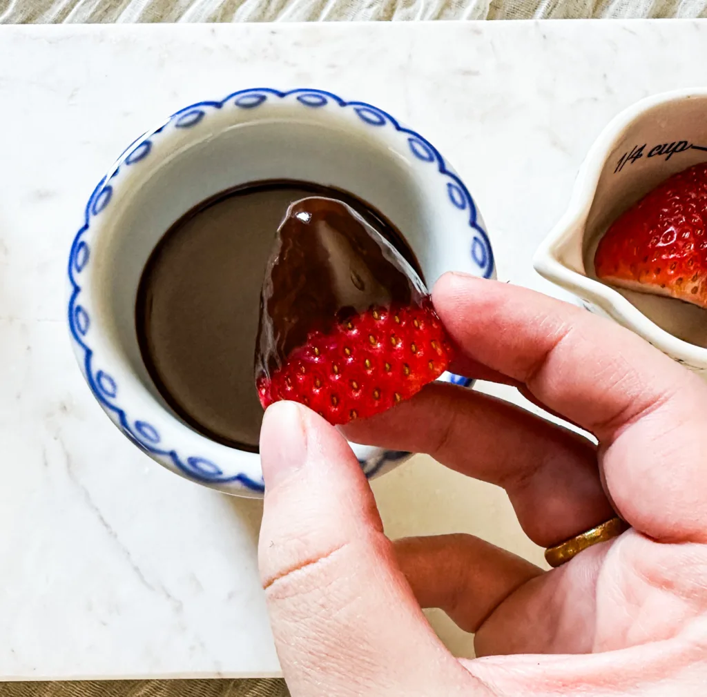 A strawberry dipped in my chocolate sauce recipe.