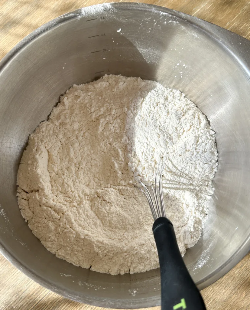 Flour, baking powder, salt, and sugar  in a mixing bowl with a wire whisk.