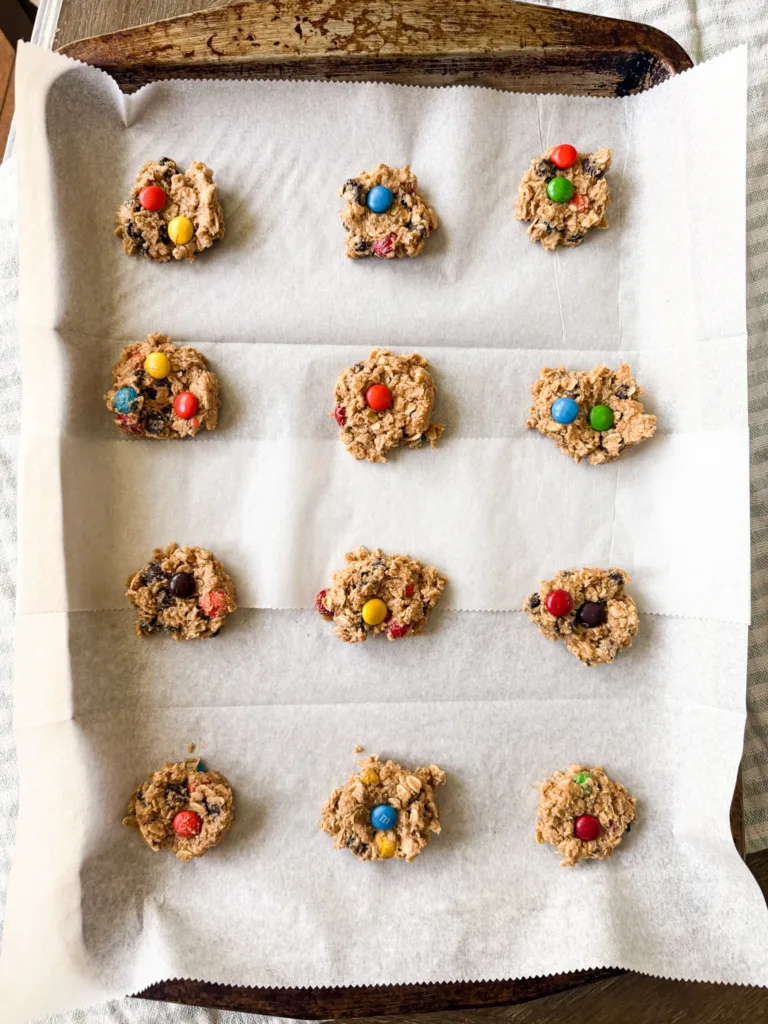Einkorn monster cookies on a baking sheet before being placed into the oven.